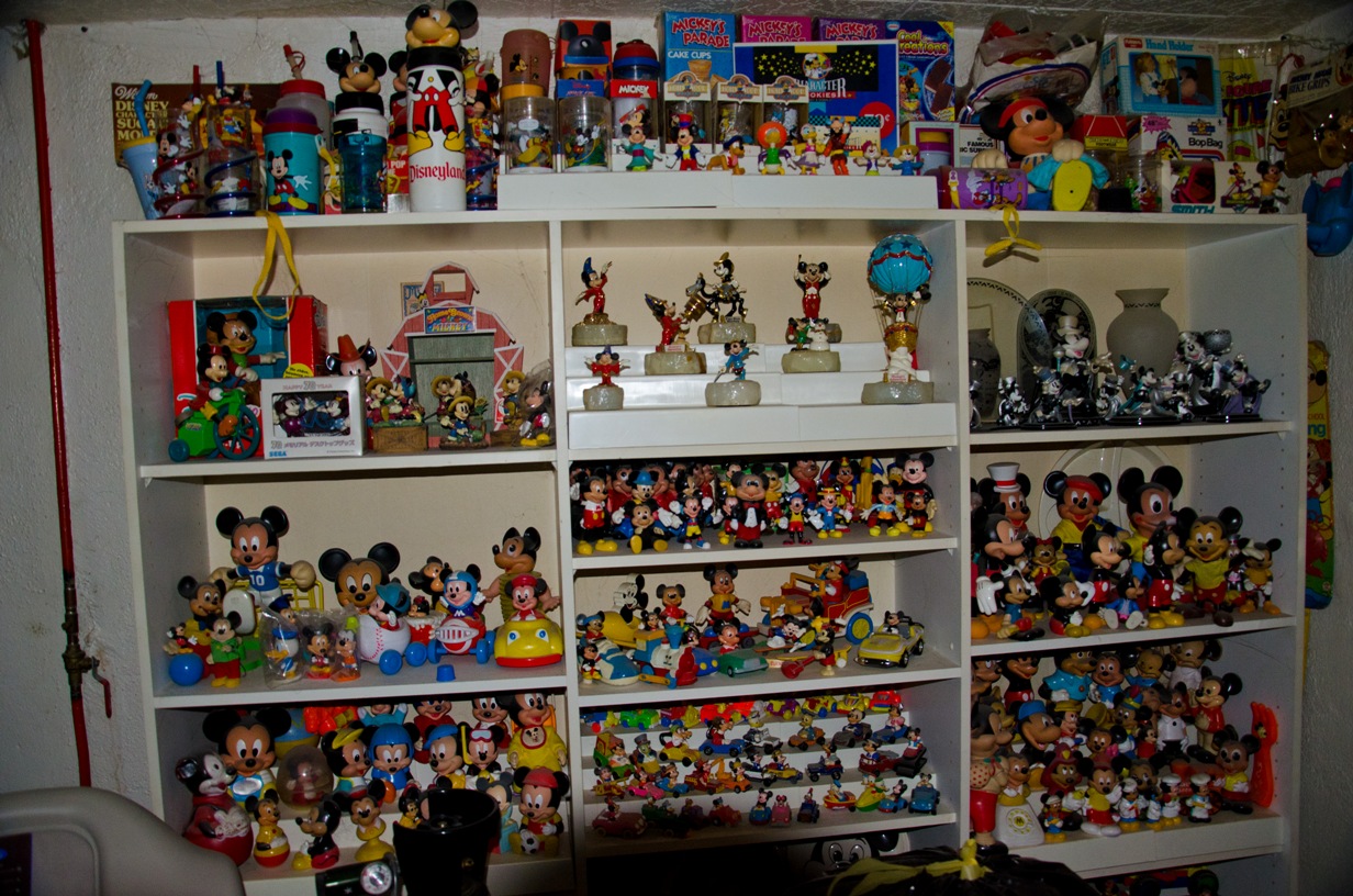 Case displaying Mickey Mouse toys
