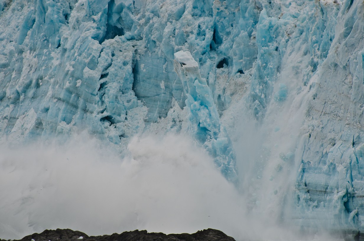 Large iceberg calving from face of Hubbard Glacier