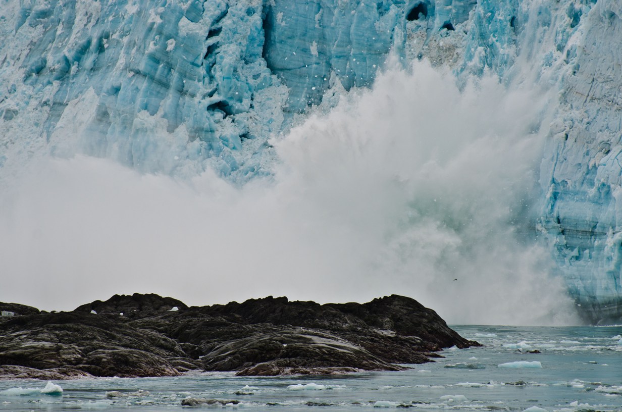 Iceberg from the face of Hubbard Glacier crashing into Yakutat Bay